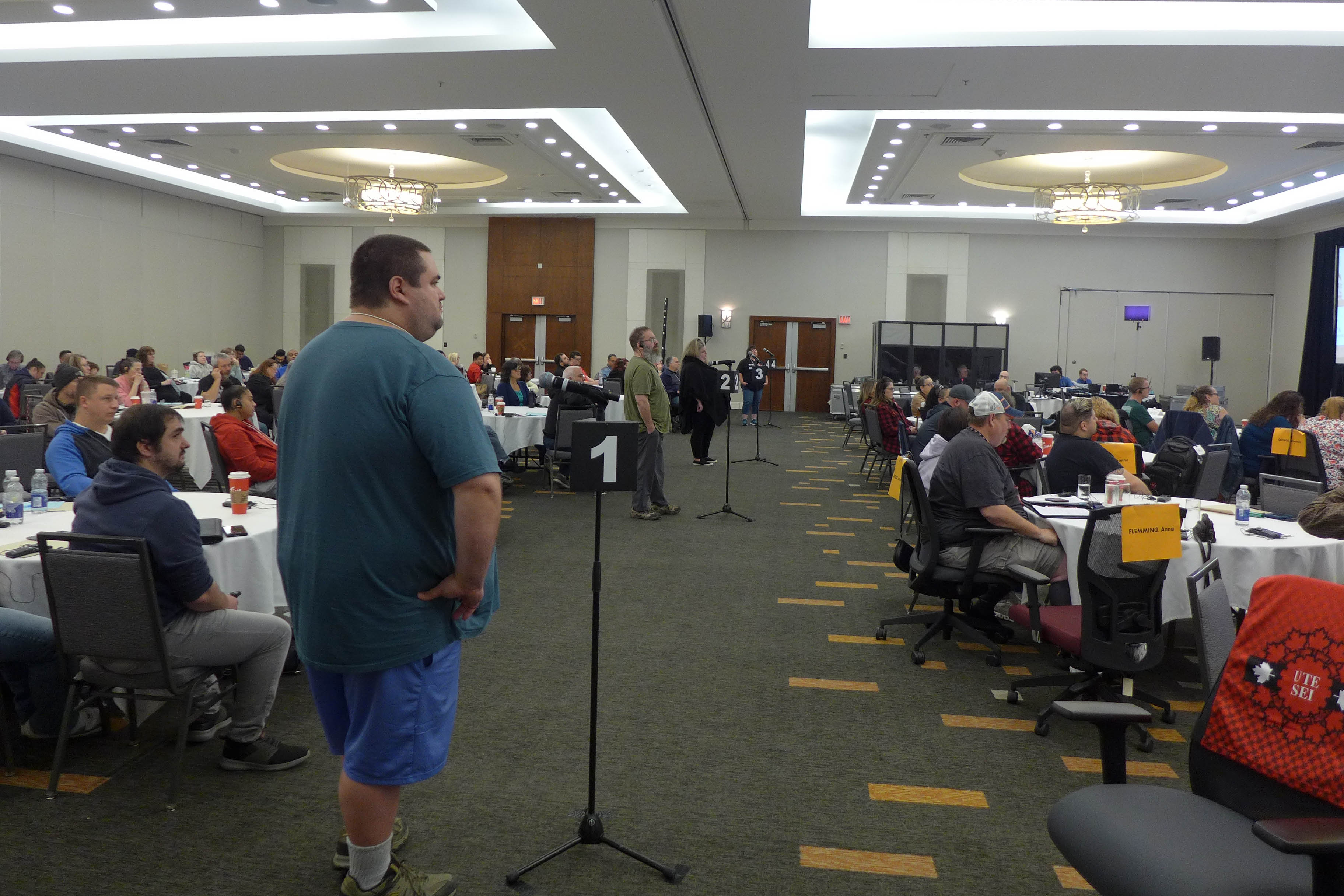 Participants at microphones