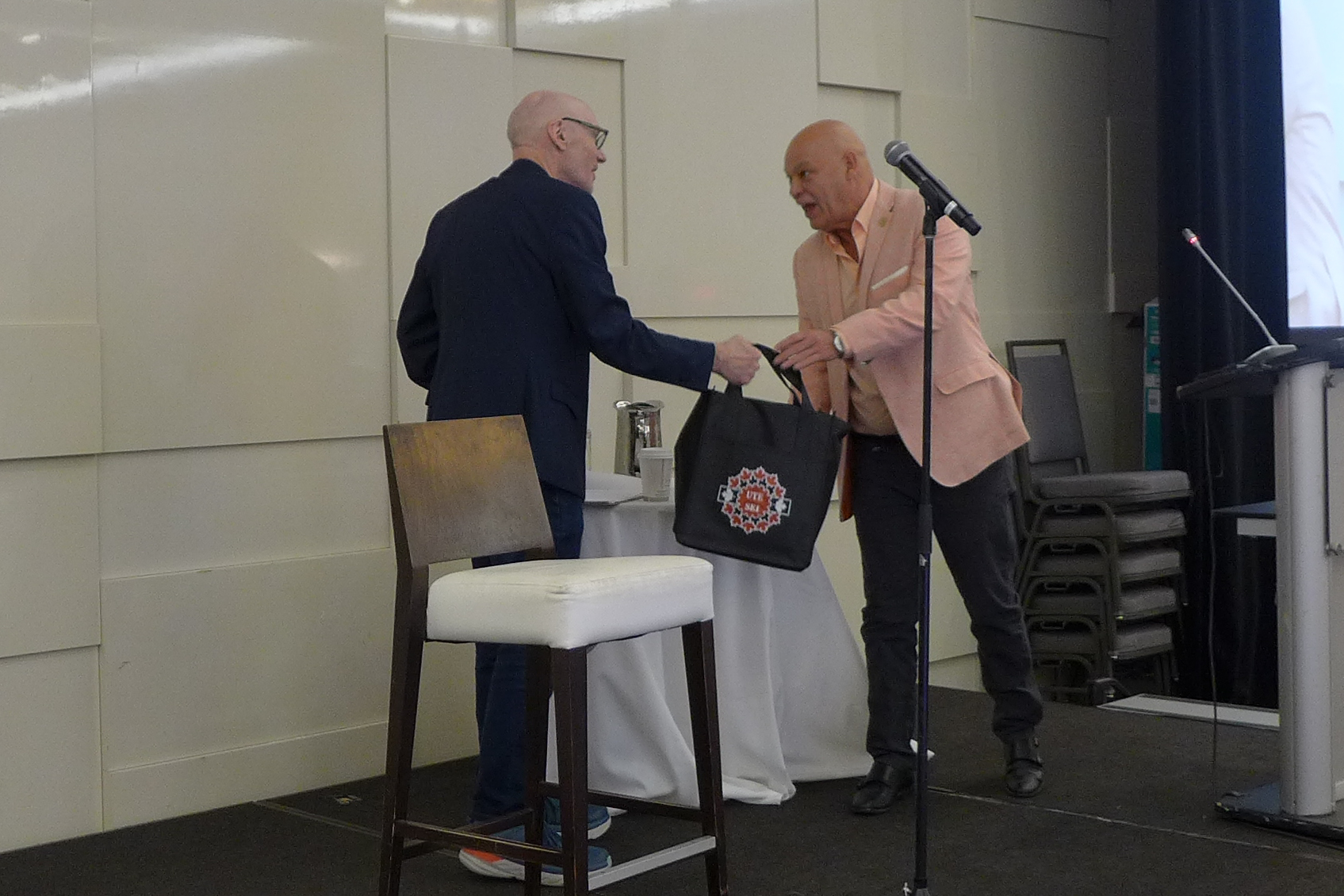 David Granirer receives a thank-you gift from Doug Gaetz