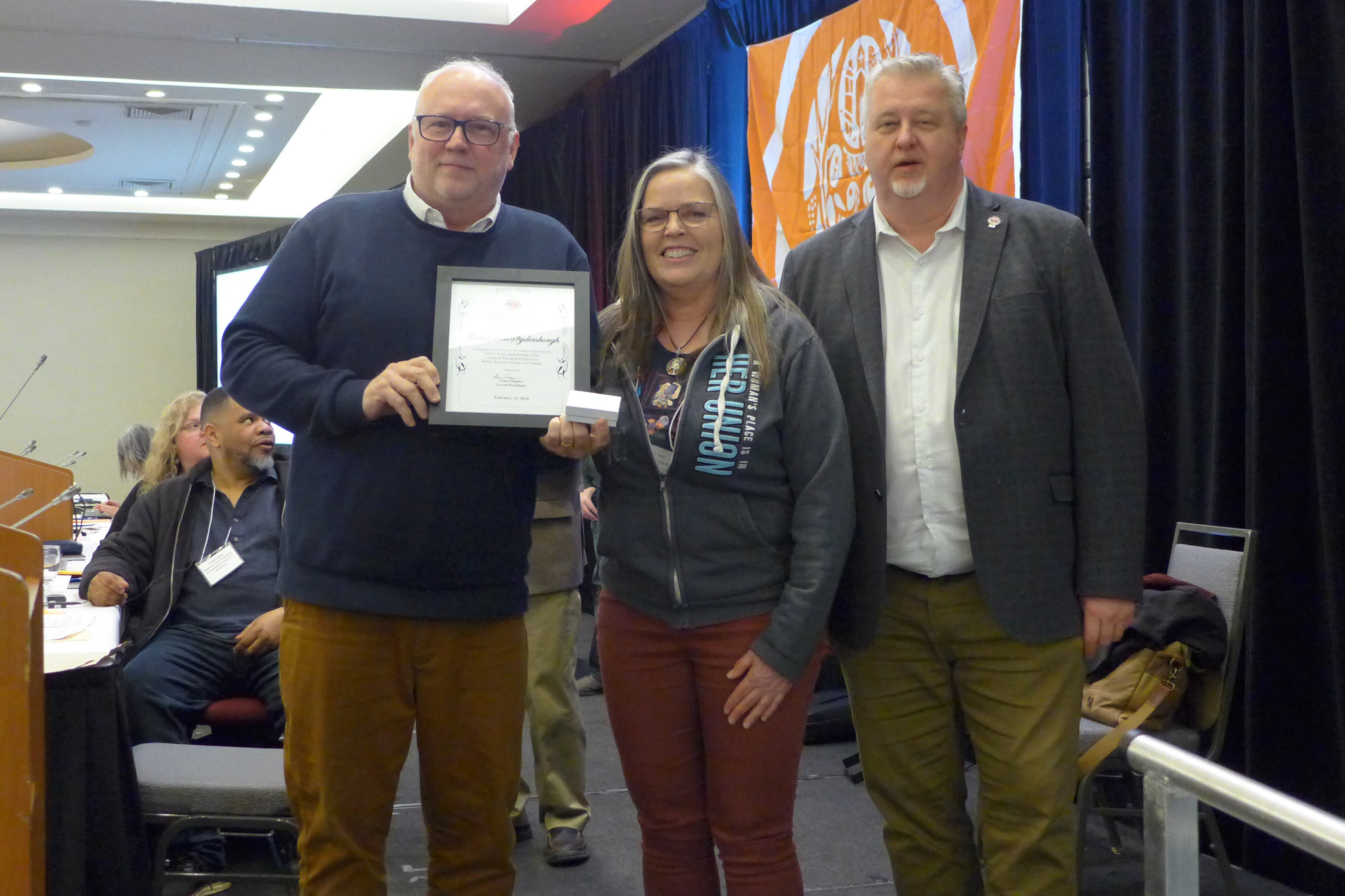 Jamie vanSydenborgh receives a presentation from the Hamilton Local