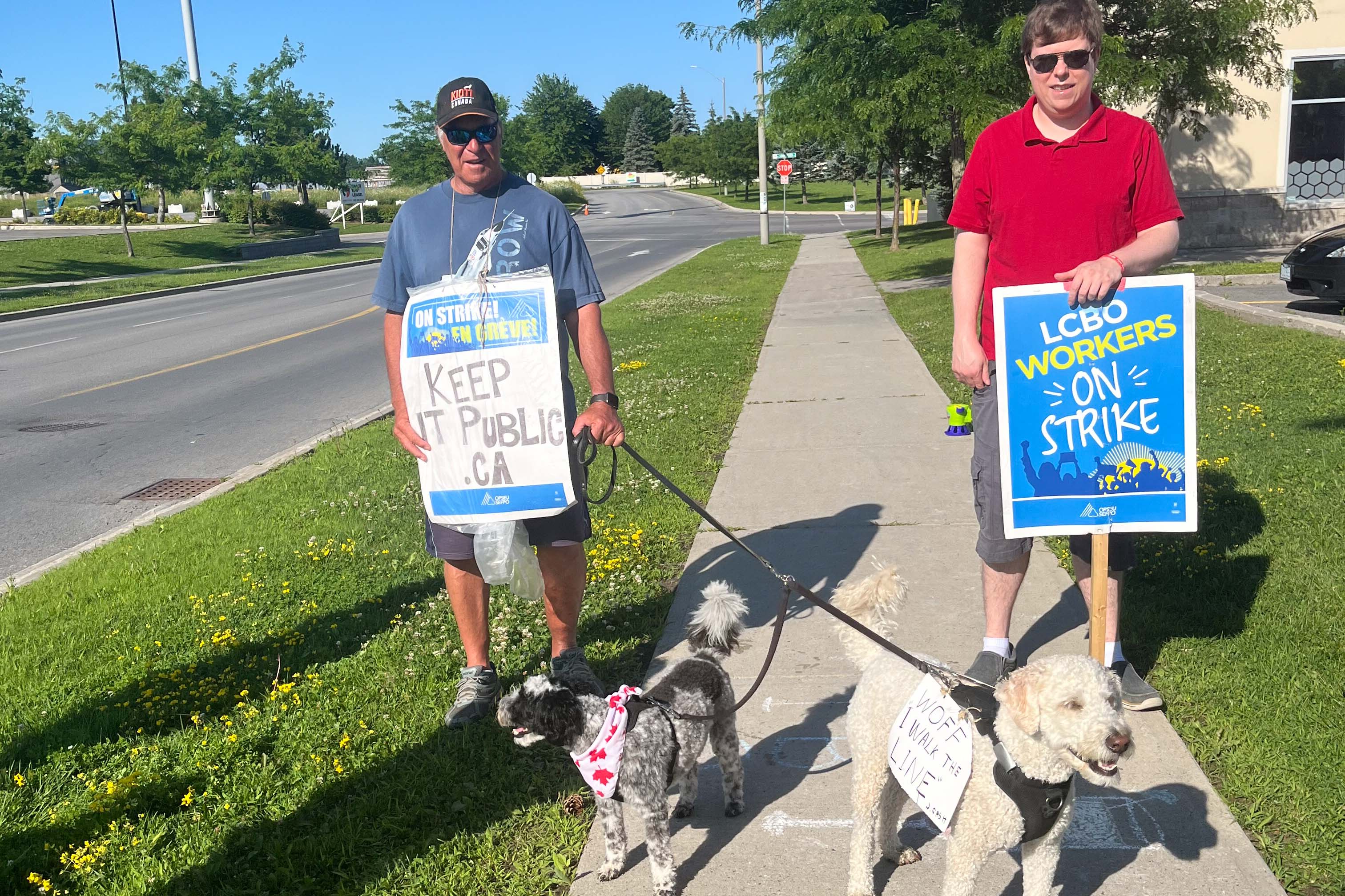 striking LCBO workers with their dogs 