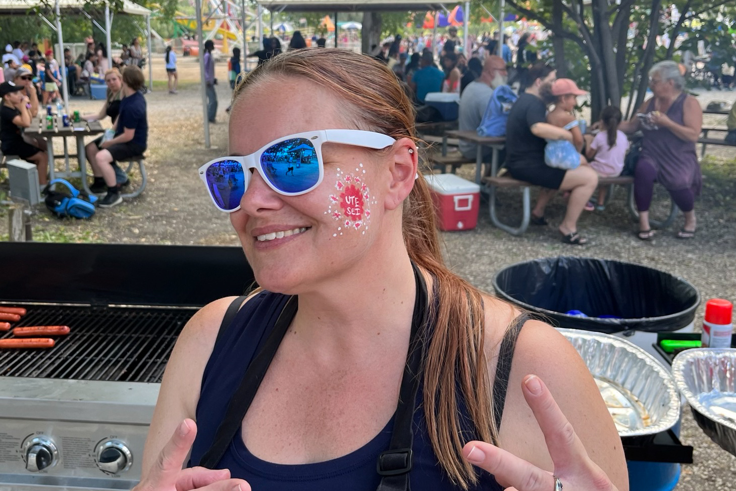 woman with UTE logo face painting
