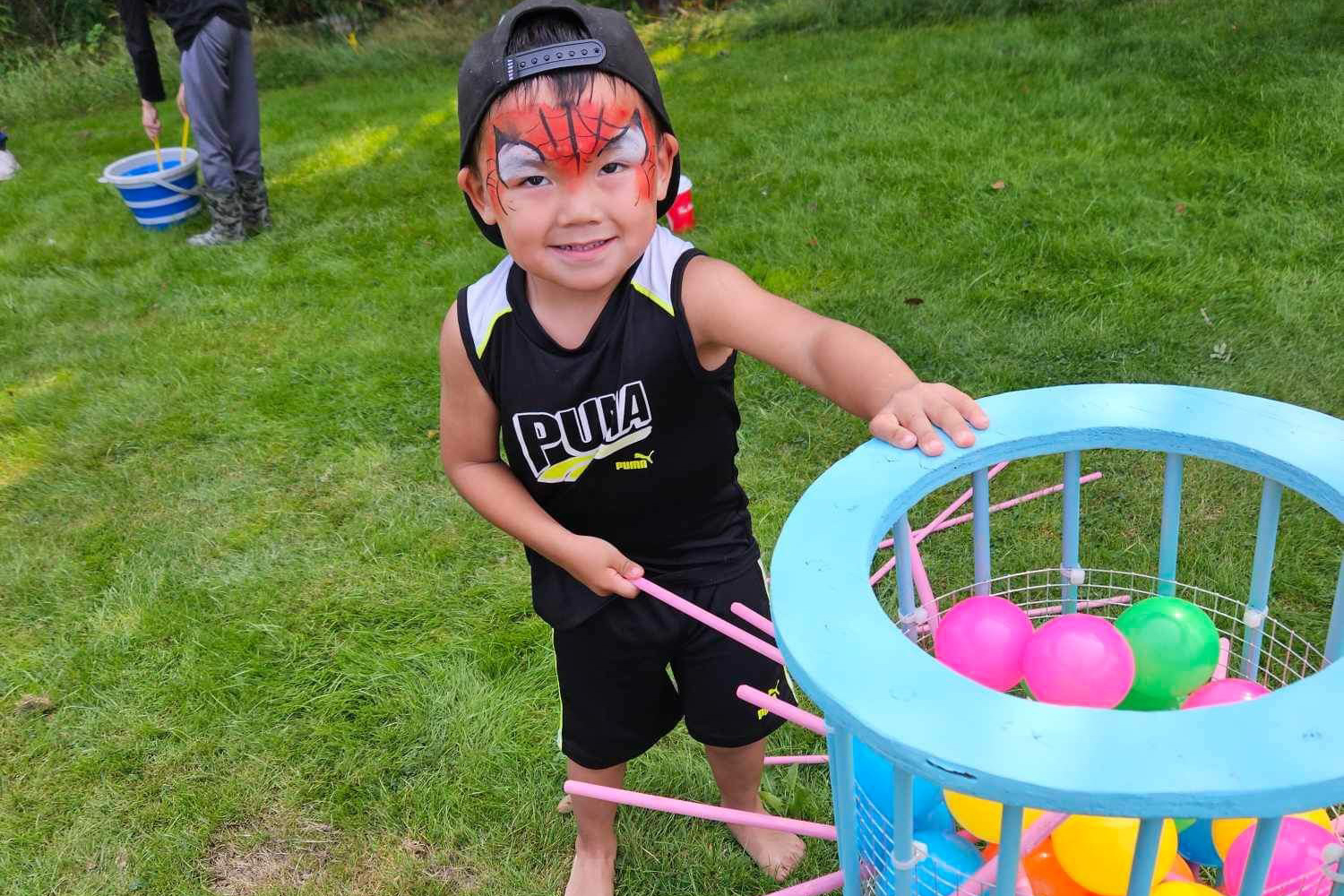 face painted child playing a game