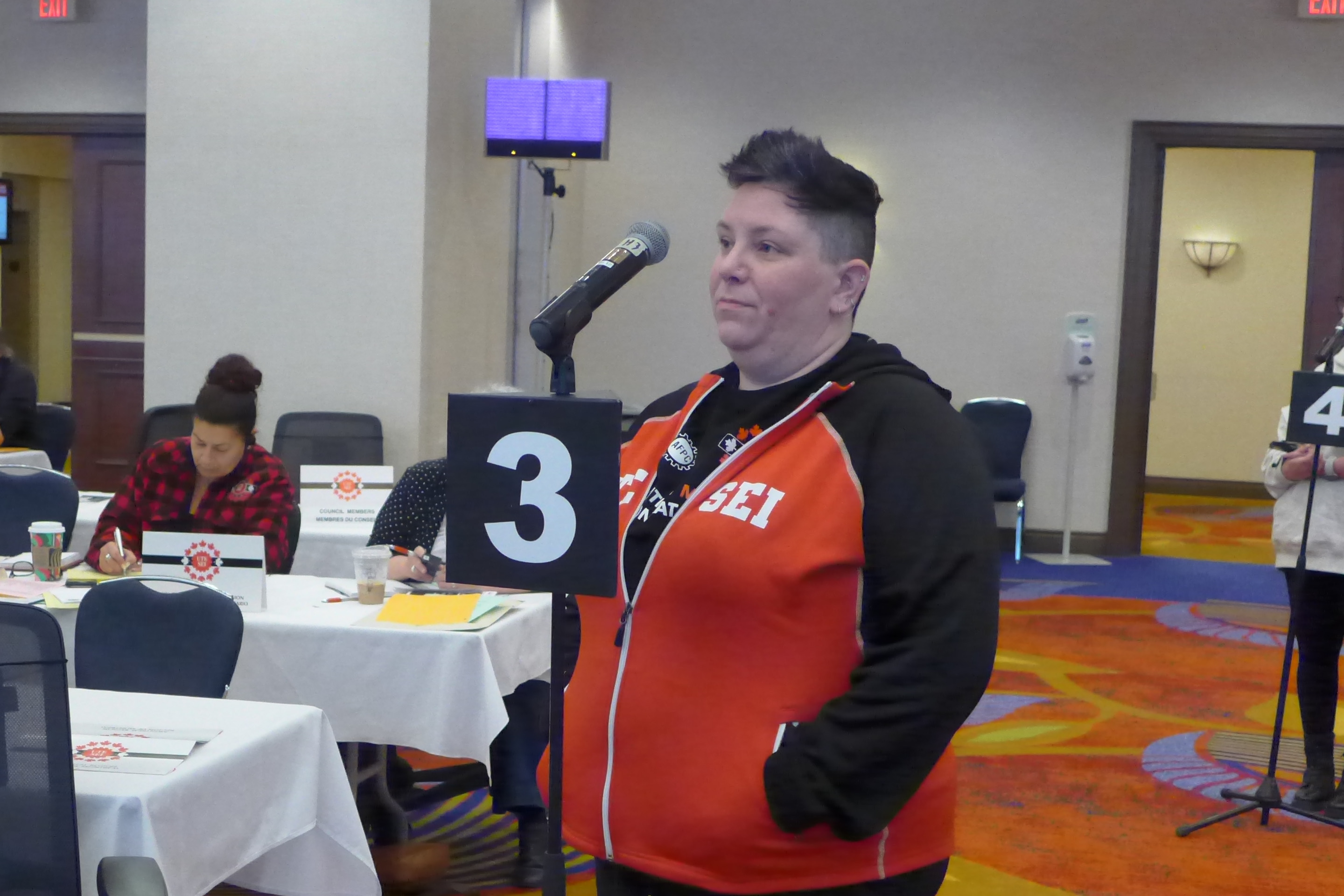 Ashley Green at a microphone