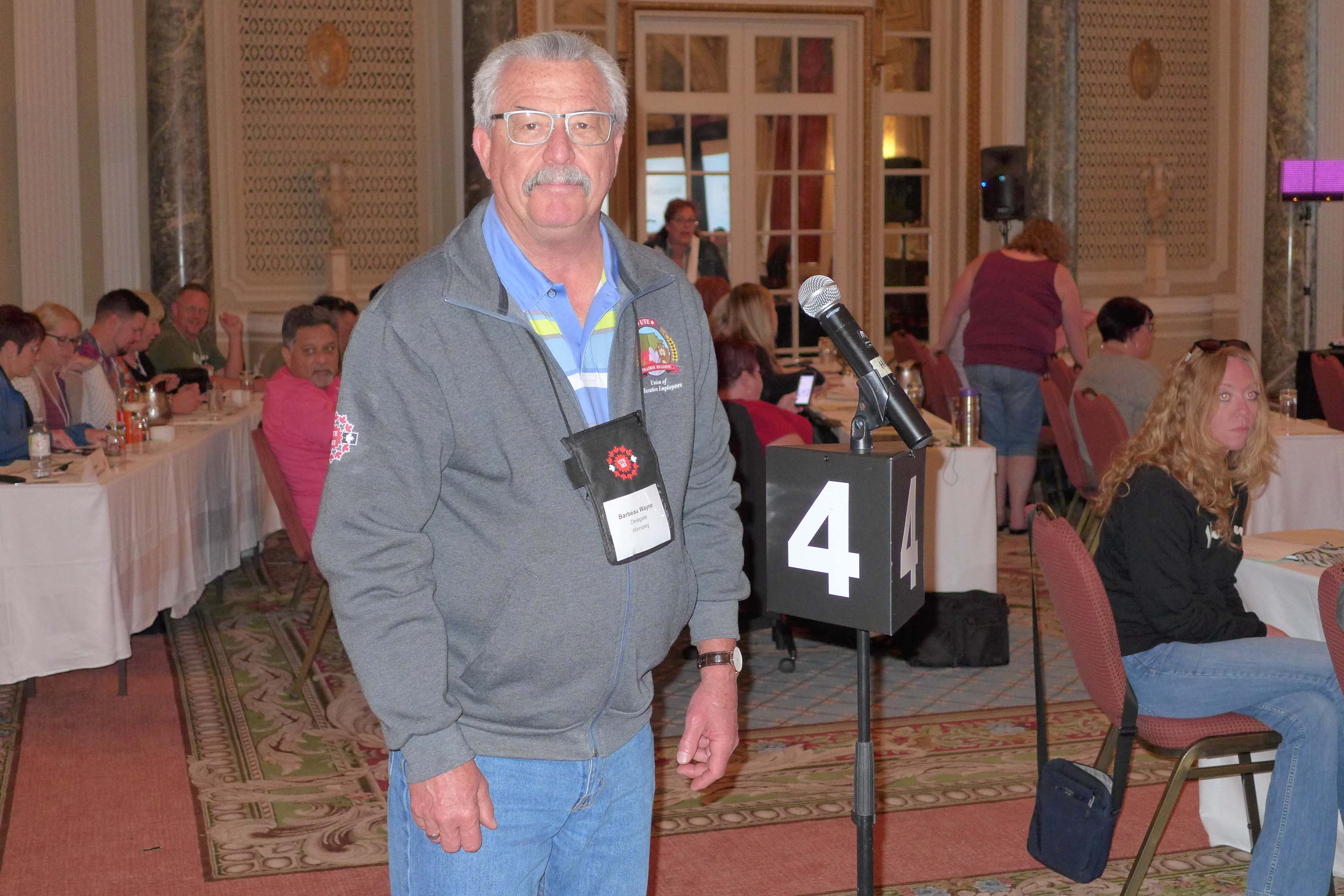 Wayne Barbeau at the Presidents' Conference asking for donations from the participants