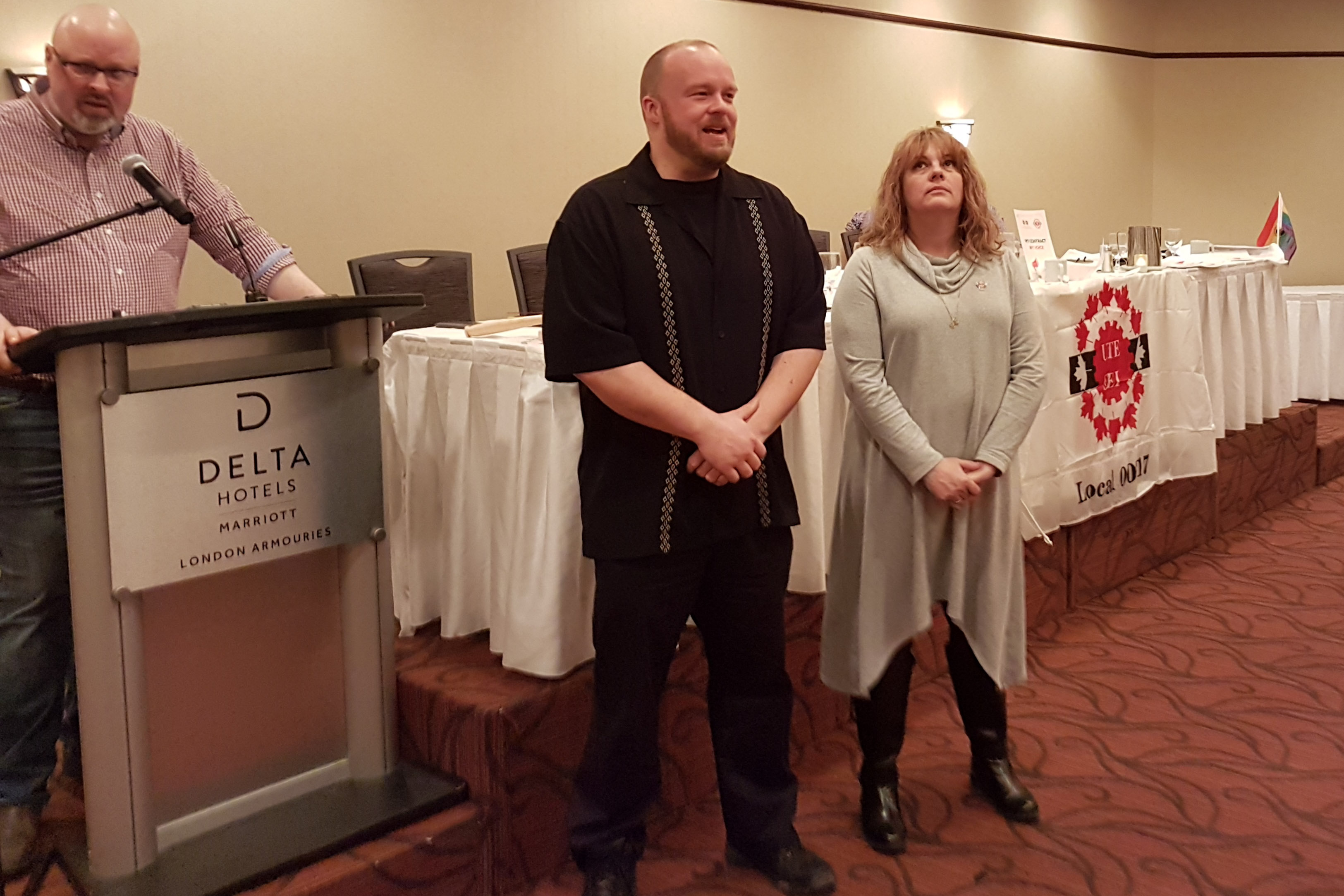 Kelly Berkin and Mark Biel being presented with their 3 year service pins