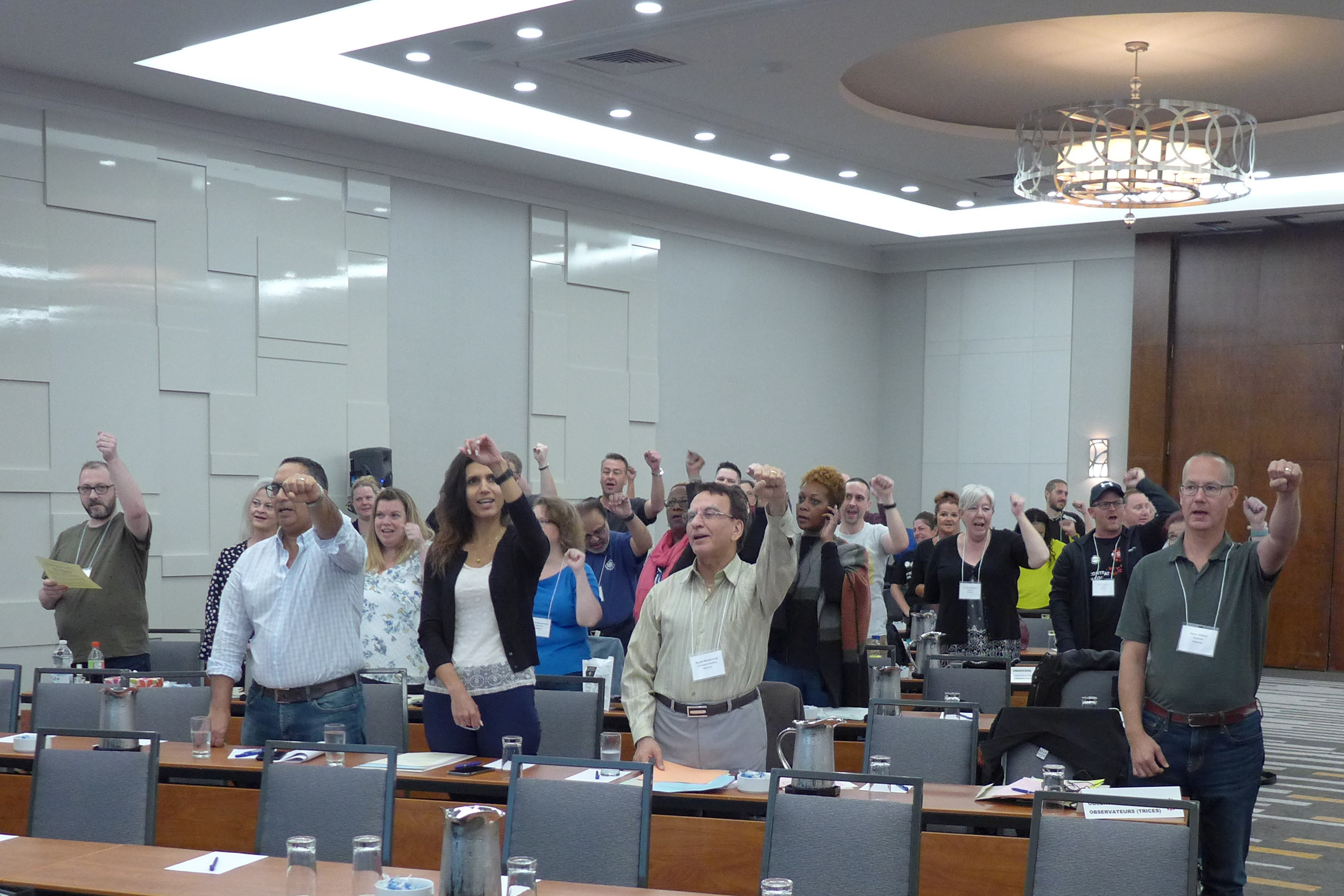 Observers singing Solidarity Forever