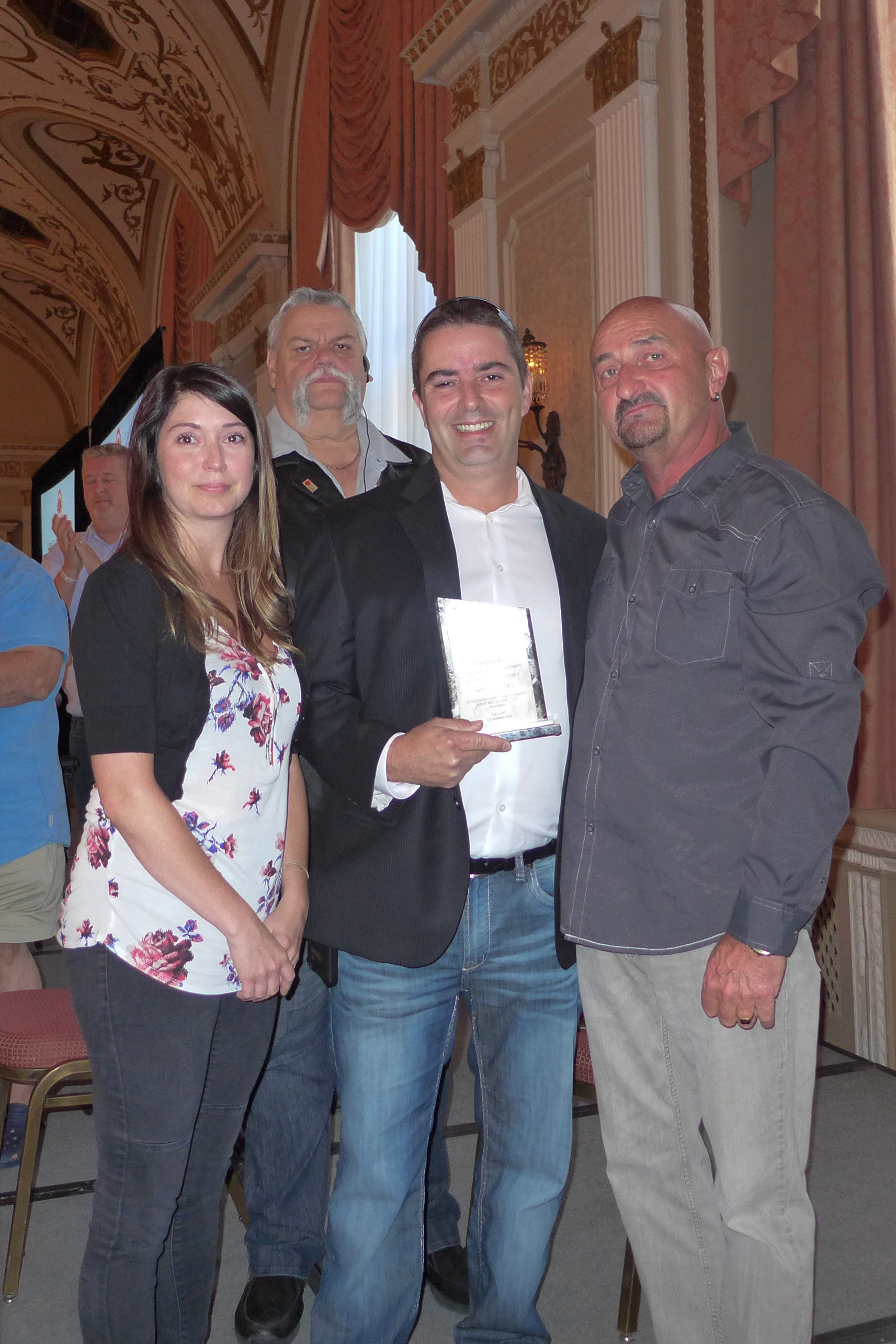 Carmen Armstrong received an Honorary Membership in UTE posthumously.  Her children Chantale Bénac and Rock Deschenes accepted the award.  Also in the photo, Robert Campbell National President and Shane O'Brien Senior Labour Relations Officer