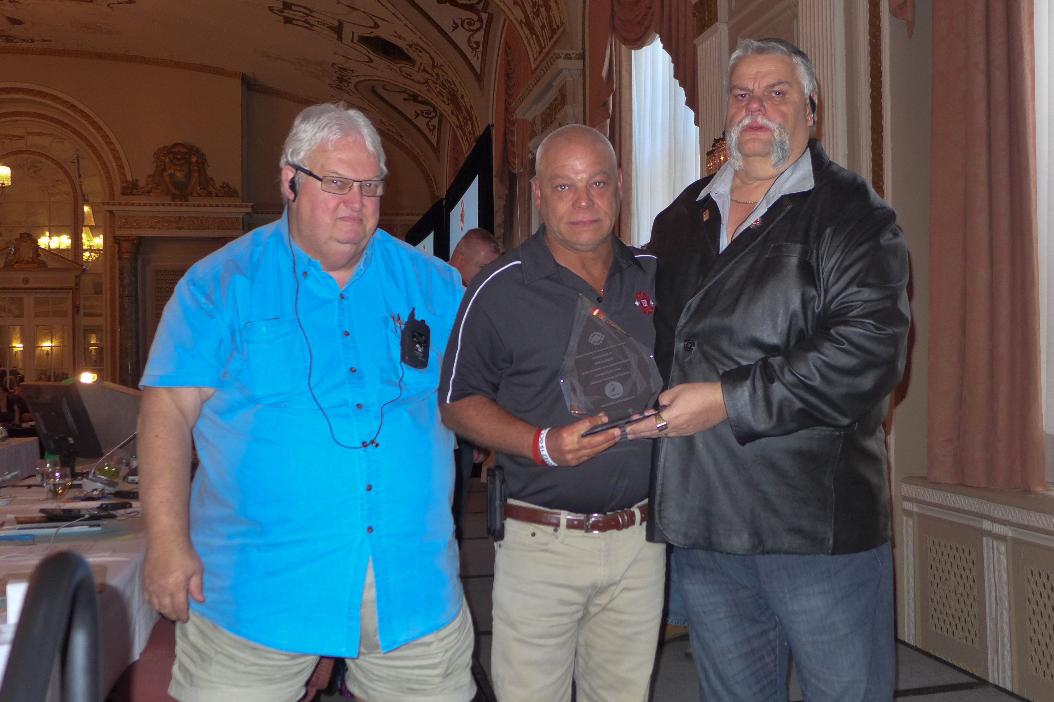 Doug Gaetz received the Award of Merit in the Field of Health and Safety - Elizabeth (Betty) Bannon.  In the photo: Denis Lalancette, Doug Gaetz, Robert Campbell