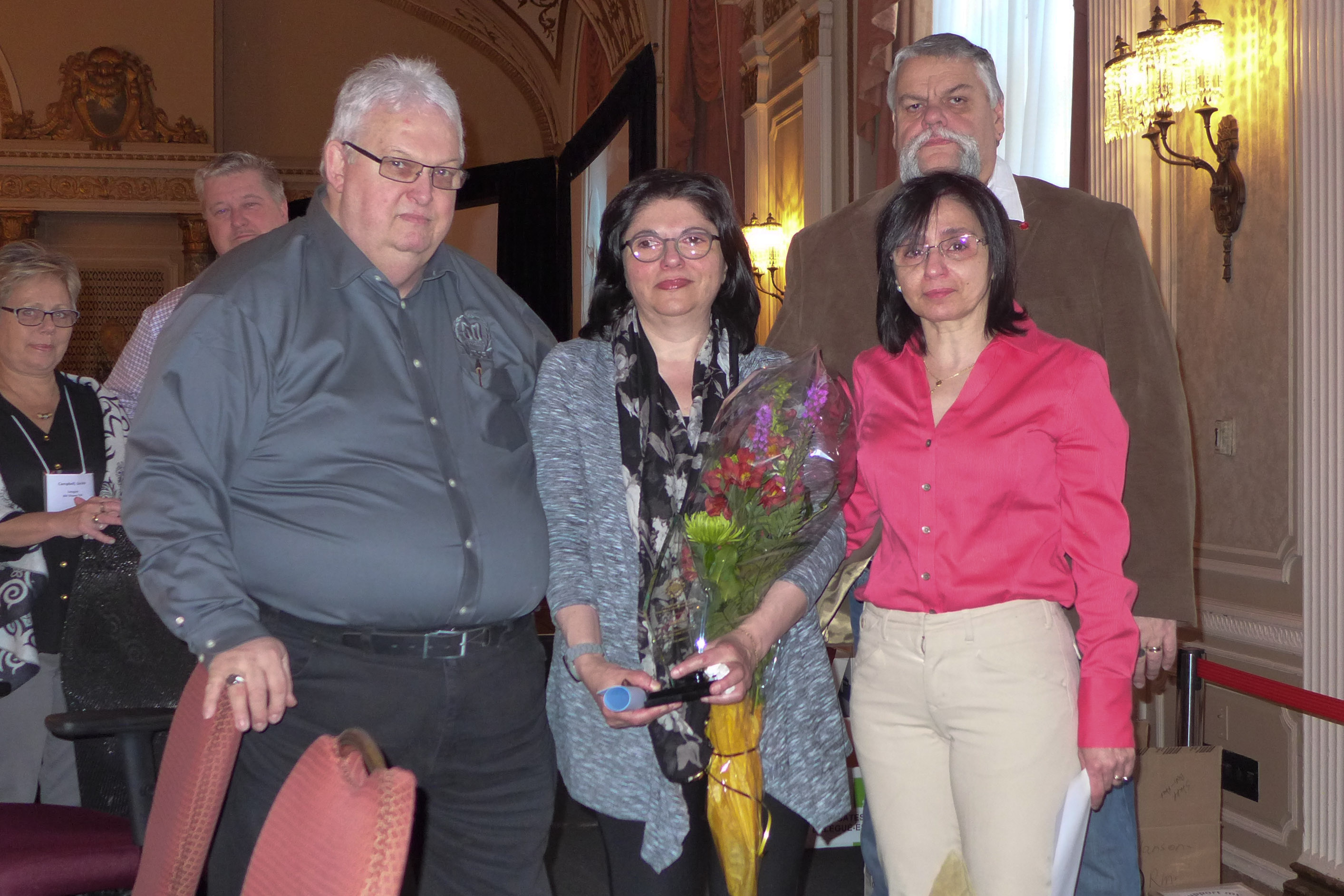 Sabri Khayat received the honorary title of Life Member posthumously.  His wife, Lina Zoobi accepted the award.  In the photo: Denis Lalancette, Lina Zoobi, Dounia Chahla and Robert Campbell