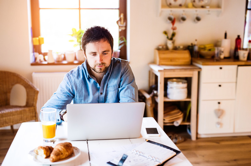 photo of a man working from home