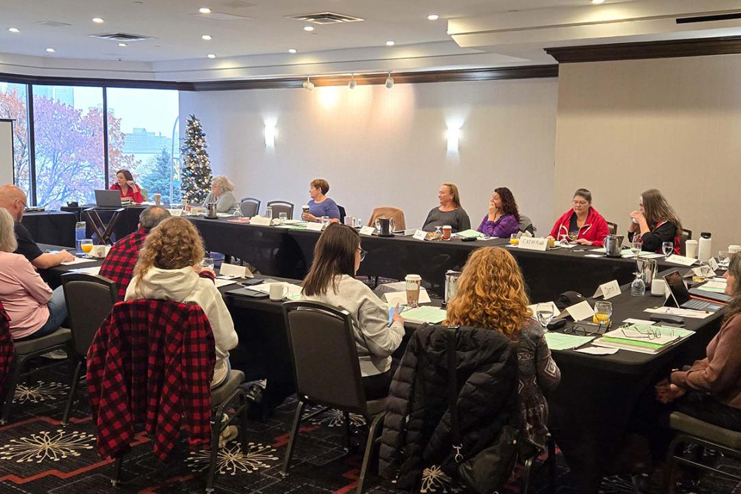 Members seated in a conference room during a union meeting.
